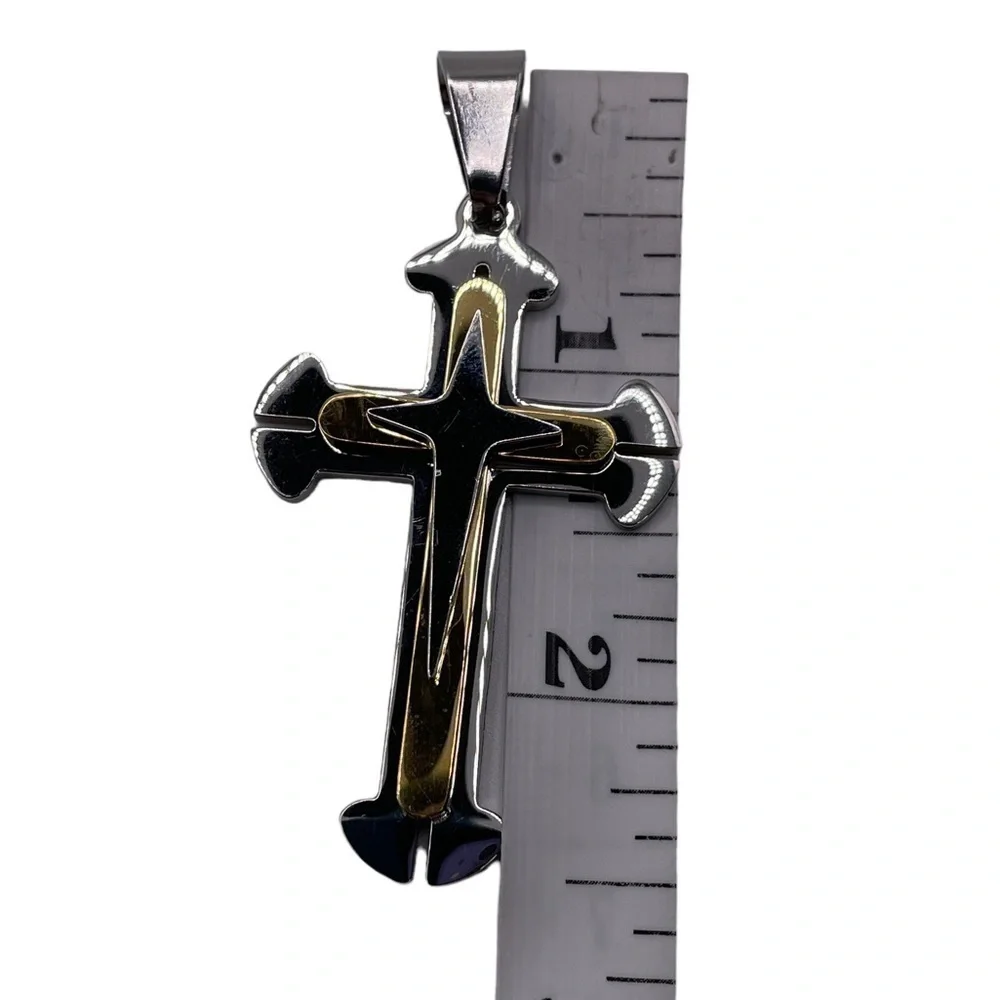Silver and gold colored cross pendant
